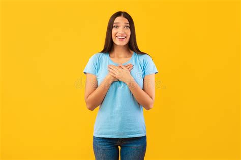 Impressed Woman Keeping Her Hands On Chest Stock Photo Image Of Cute