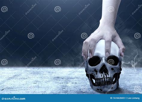 Hand Holding Human Skull Above The Floor Stock Image Image Of Design