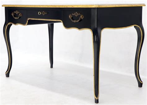 A black lacquer console/sofa table with gold trim and a gold leaf tree motif inlay. Baker Country French Black Lacquer Gold Trim Leather Desk ...