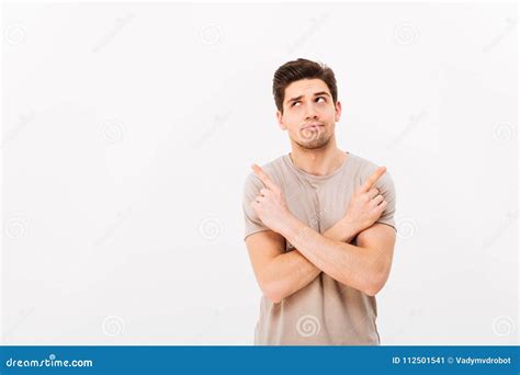 Image Of Muscular Brooding Man Wearing Beige T Shirt Gesturing F Stock