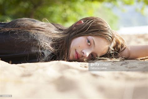 Teenage Girl Lying On Beach Photo Getty Images