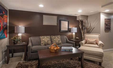 Griege Walls Contrasting Against A Dark Brown Accent Wall Basement In