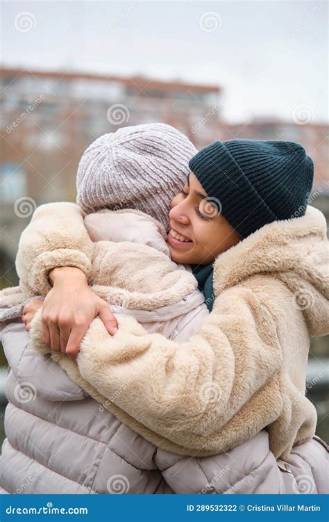 Dominican Lesbian Couple Hugging With Affection And Love At Street In