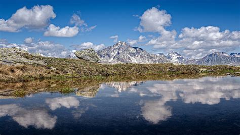 Panorama Switzerland Mountain Reflection On Lack With Blue Sky And