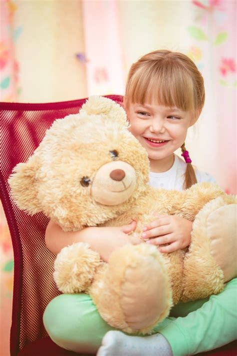 Little Girl Hugging Teddy Bear Stock Photo Image Of Girl Child 66066056