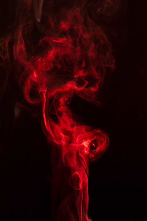 Are you searching for red smoke png images or vector? Realistic red smoke on black background | Free Photo