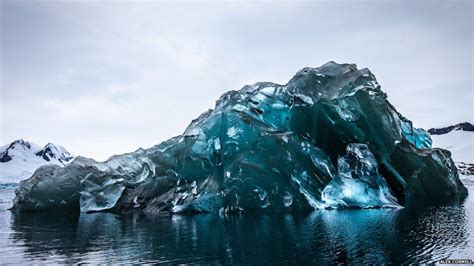Upside Down Iceberg In Antarctica Looks Like Blue Glass Bbc Newsround