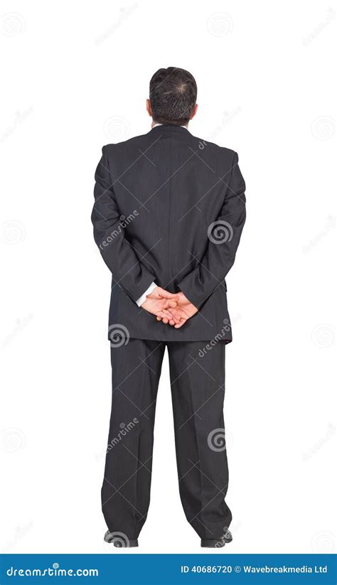 Mature Businessman Standing With Hands Behind Back Stock Photo Image