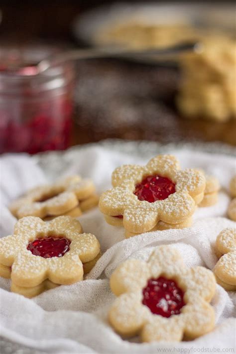 Cookies with strawberry jam, shortbread with strawberry jelly, closeup. Austrian Jam Cookies / Austrian Jam Cookies | Leslie the Foodie : Roll balls into slivered ...