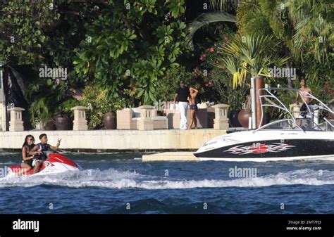 Exclusive Hip Hop Mogul Sean P Diddy Combs Enjoys A Glass Of Wine And A Smoke On The Dock Of