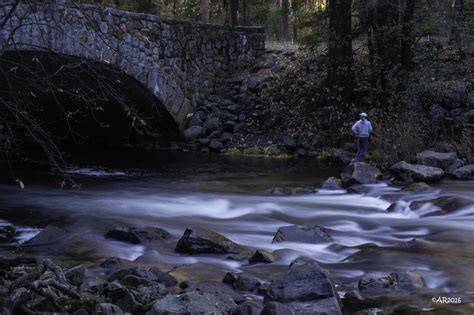 Man Standing In The Rock Near The Bridge And River Merced River Hd