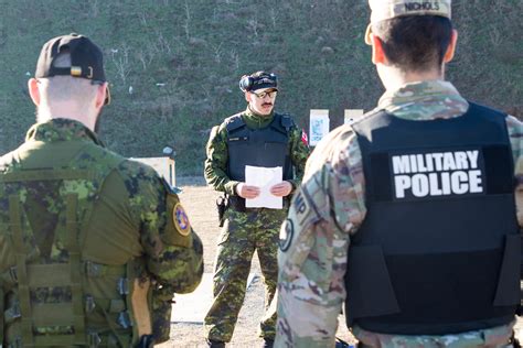 Us And Canadian Military Police Conduct Weapons Training In Romania