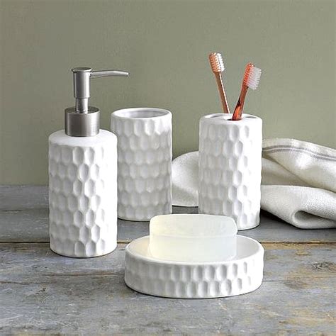 This elegantly designed bathroom set includes an unusual and quite beautiful square soap dish, a liquid soap/lotion dispenser, a toothbrush holder, tissue box cover, a clear glass tumbler in a patterned stand and a wastebasket. Stainless Steel Bath Accessories - Decoration Channel
