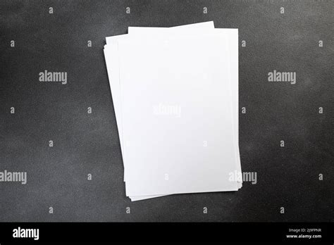 White Business Card Sheet Of Paper A4 Stack On A Dark Table Clean