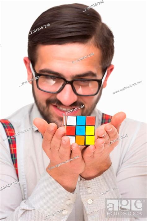 Concept Happy Nerd Confident Handsome Boy Nerd Holding A Puzzle Cube
