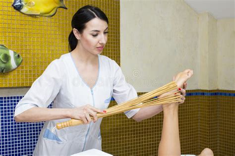Massage With Bamboo Sticks In Spa Salon Stock Photo Image Of Lifestyle Healthy