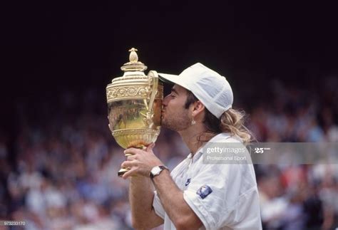 Andre Agassi Of The Usa Kissing The Trophy After Defeating Goran