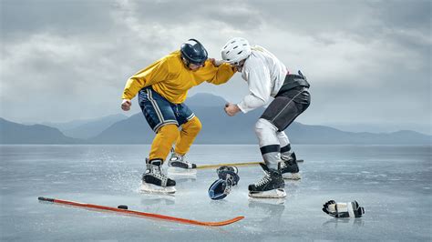 Download Hockey Player In Ice Skating Rink Wallpaper