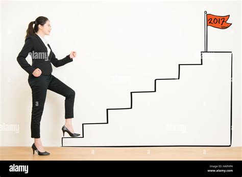 View Of Businesswoman Climbing The Stairs Of Drawing To 2017 Concept