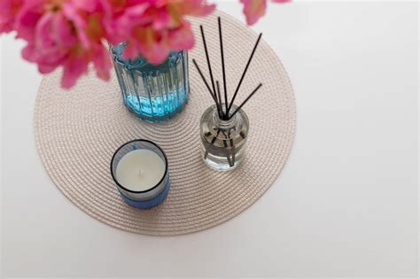 Premium Photo Aroma Reed Diffuser Flower Vase And Candle On White Table