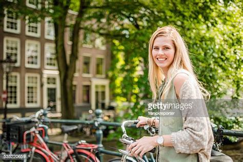 Dutch Woman With Bicycle In Amsterdam Photos And Premium High Res Pictures Getty Images