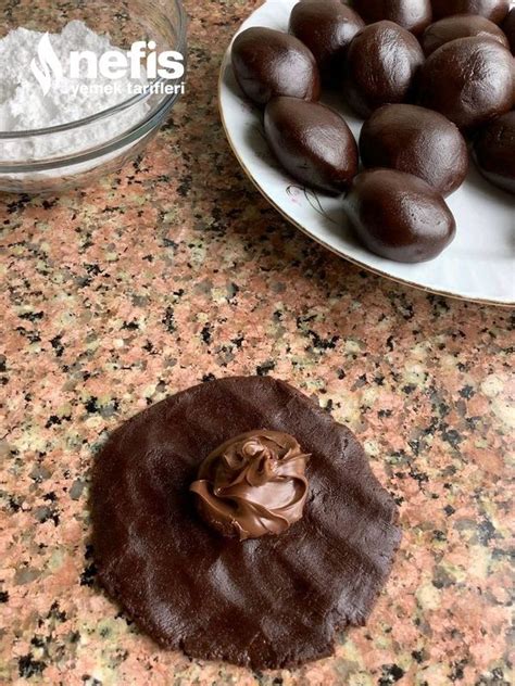 Some Chocolates Are Sitting On A Plate Next To Other Food