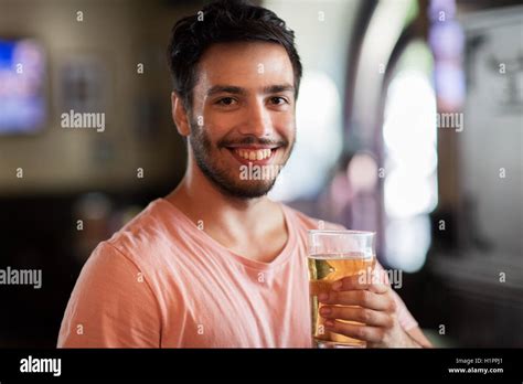 Happy Man Drinking Beer At Bar Or Pub Stock Photo Alamy