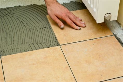 Ceramic tile over concrete basement floor. How to tile a concrete floor | Flooring, Diy kitchen ...