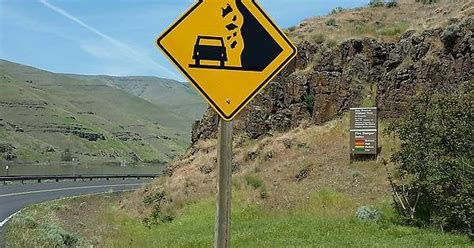 This Falling Rock Sign Has A Falling Cow Rmildlyinteresting