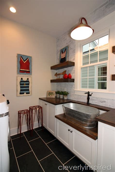 This beautiful laundry room is decorated with small house plants. Farmhouse Laundry Room : #homearamahouse15 - Cleverly Inspired