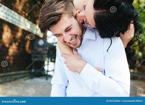 Woman Embracing Her Boyfriend From Behind Stock Photo Image Of Laugh