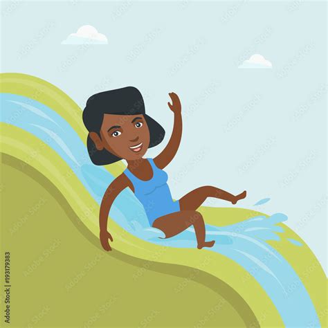 Young African American Woman Riding Down A Waterslide In Aquapark