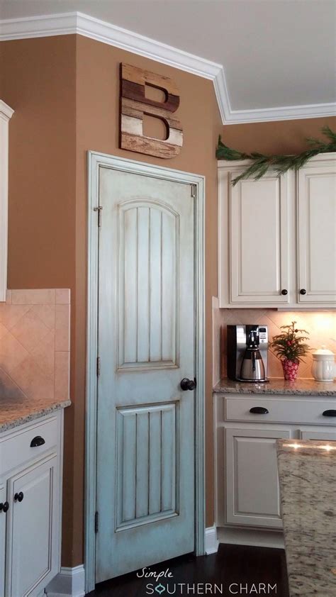 The brush is for the recessed areas and the tops and bottoms of the door. Aqua pantry door update | Simple Southern Charm