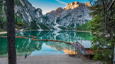 Llonely Man At The Lago Di Braies In Dolomites Italy Editorial