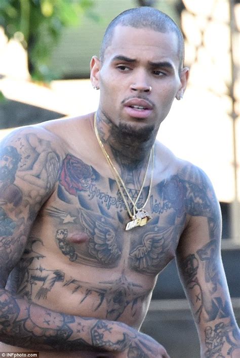 American rapper chris brown has had tattoos ever since he was 13 years old. Chris Brown shows off his tattooed chest on set of new ...