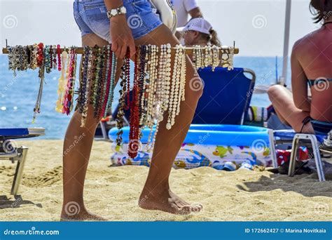 Summer Vacation Holiday Legs Of Girl Selling Jewelry On Beach Editorial Photography Image Of