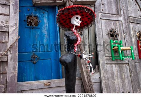 Skeleton Statue Sombrero Wooden Doors Background Stock Photo 2221678807