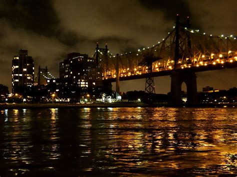 The Queensborough Bridge With Roosevelt Island In The Background In