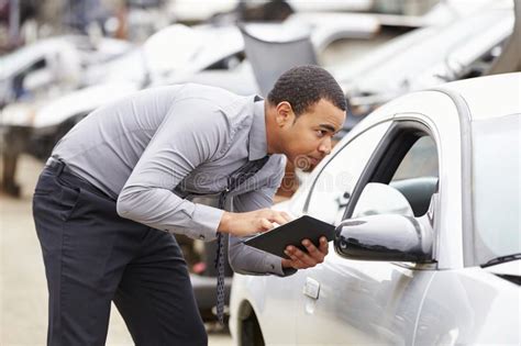 What is the purpose of the inspection? Loss Adjuster Using Digital Tablet In Car Wreck Inspection ...