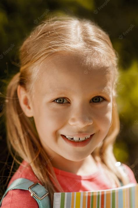 Premium Photo Portrait Of A Smiling Cute Blonde Girl