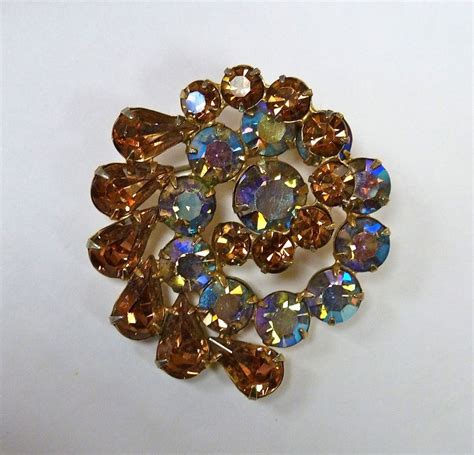 Weiss Vibrant Aurora Borealis And Topaz Rhinestone Swirl Pin From