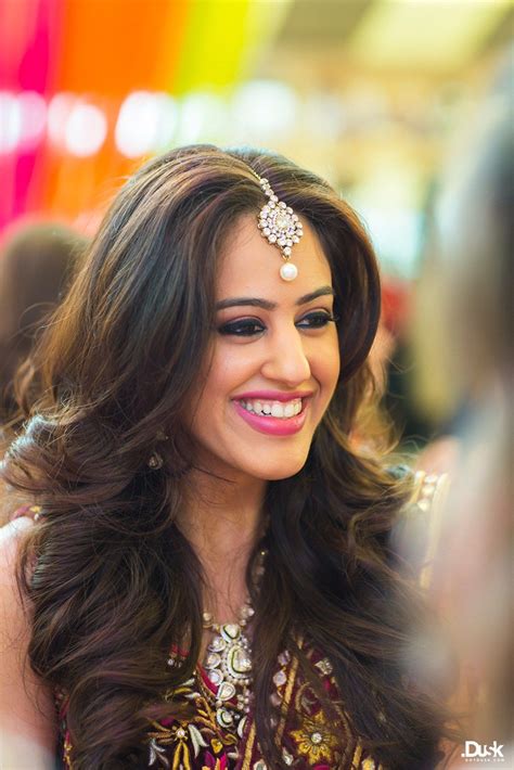 Soft curls and one big studded hairclip to tuck one side behind your ear. Mehendi Makeup and Hair | Roshni + Rohan | Indian Wedding ...