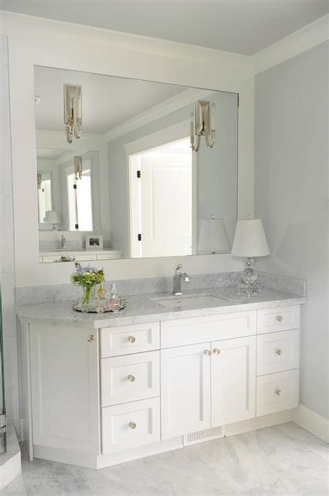 Bathrooms come in second to kitchens as places where considerable attention is given to layouts and finishes, and size doesn't limit the quality of their design. Bathroom Vanity with Angled Cabinet - Transitional - Bathroom