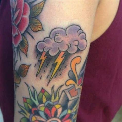This is a beautiful and cute cloud tattoo on the shoulder of a girl. Cloud Tattoos for Men - Ideas and Designs for Guys