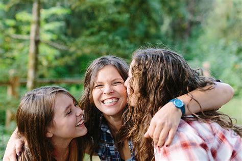 Happy Mother And Two Daughters Laughing By Stocksy Contributor Leah
