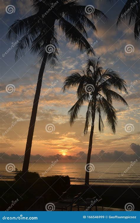 Tropical Exotic Sunrise Seascape With Palm Trees At Huay Yang Beach