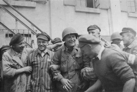 An American Officer Is Surrounded By Survivors At The Newly Liberated