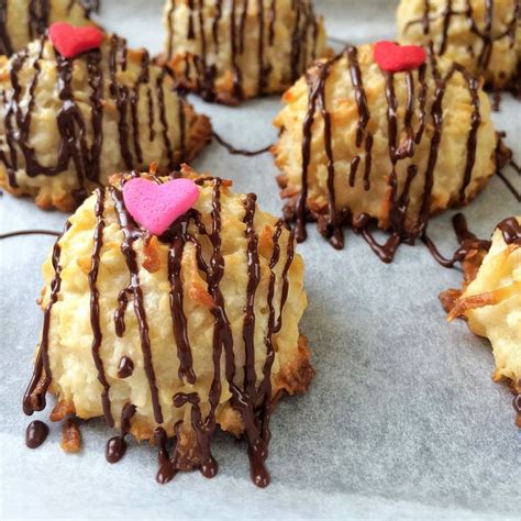 Cookies With Chocolate Drizzled And Hearts On Them