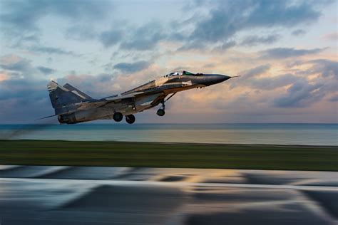 Fighter Jet Taking Off At Sunset Stock Photo Download Image Now Istock