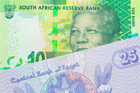 A Shiny Green 10 Rand Bill From South Africa Paired With A Blue Twenty